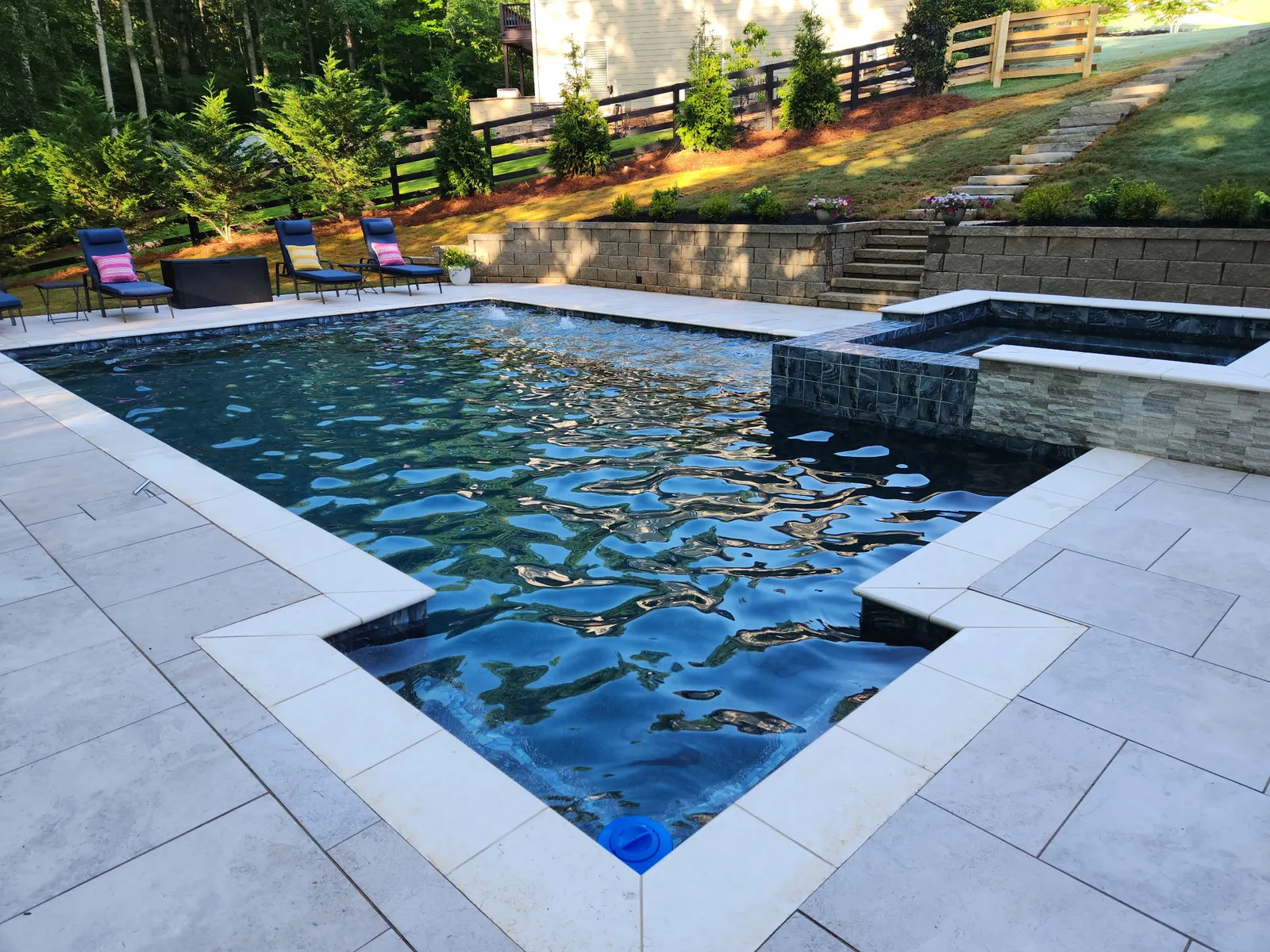 Aerial view of a finished freeform RutherfordMade pool on a wooded North Metro Atlanta lot