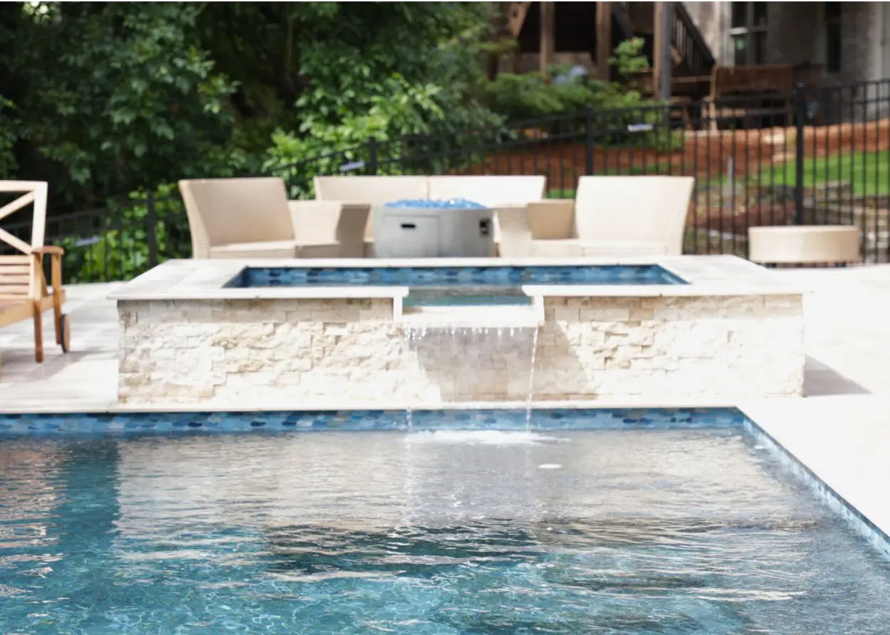RutherfordMade raised spa spillover connected to a custom pool
